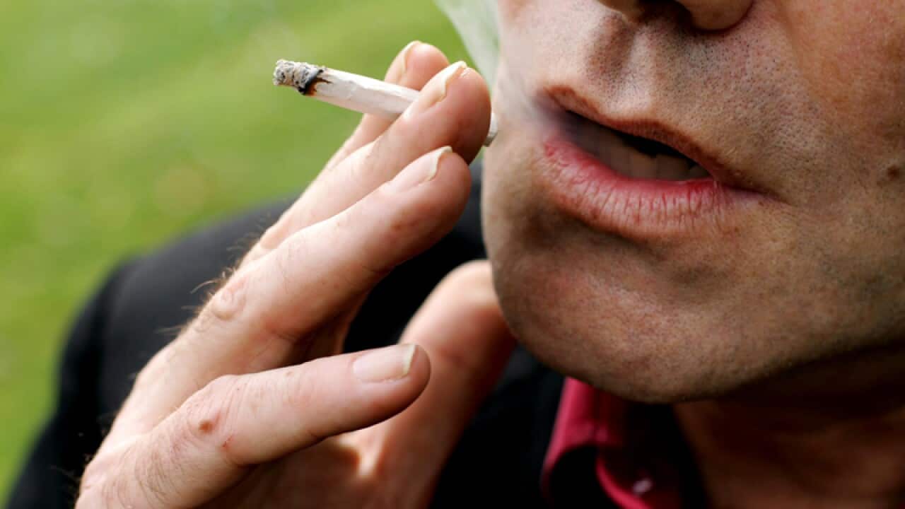 Man smoking a Marijuana joint