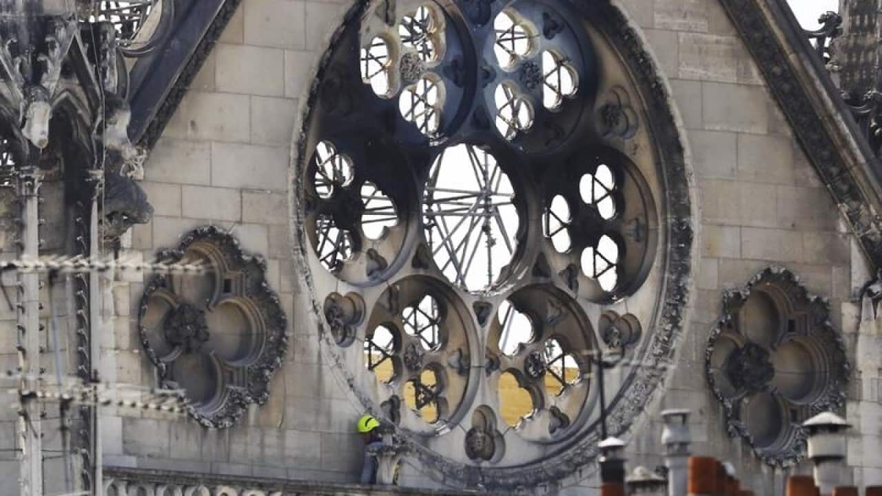 The fire-scarred north face of Notre-Dame Cathedral
