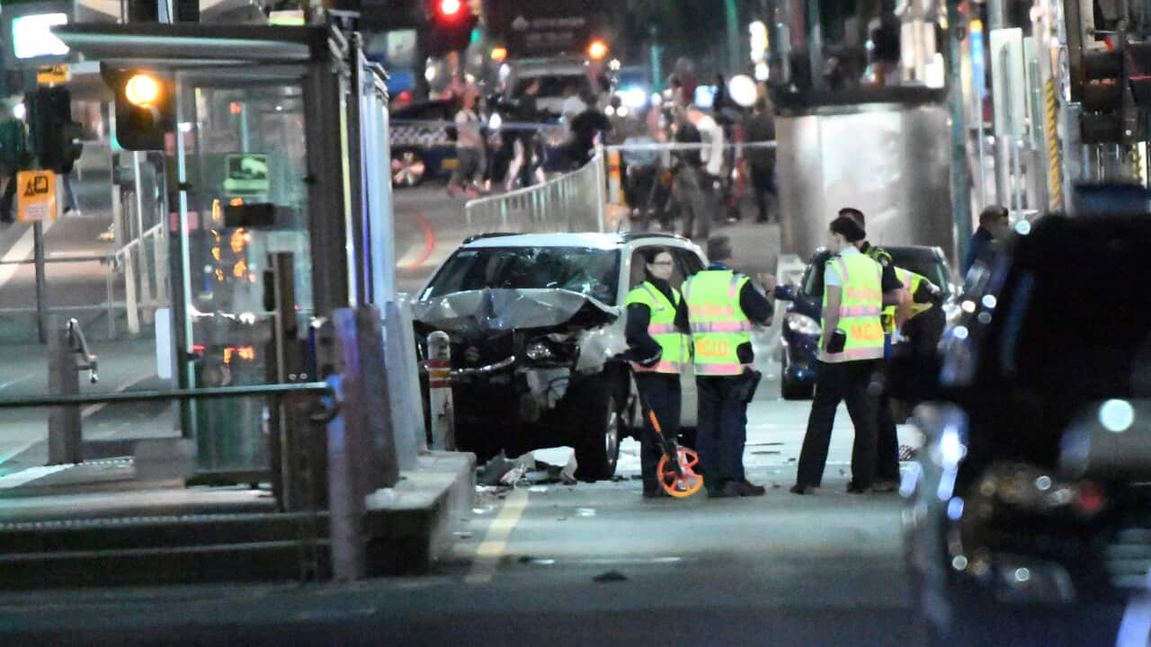 A damaged vehicle is seen at the scene of an incident on Flinders Street, in Melbourne, Thursday, December 21, 2017.