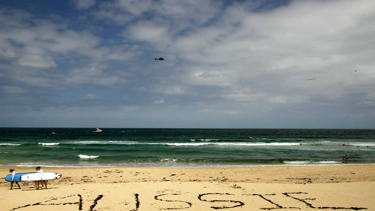 The word 'Aussie' is spelled out on Cronulla beach in Sydney, Sunday, Dec. 11, 2005. (AAP Image/Paul Miller) NO ARCHIVING