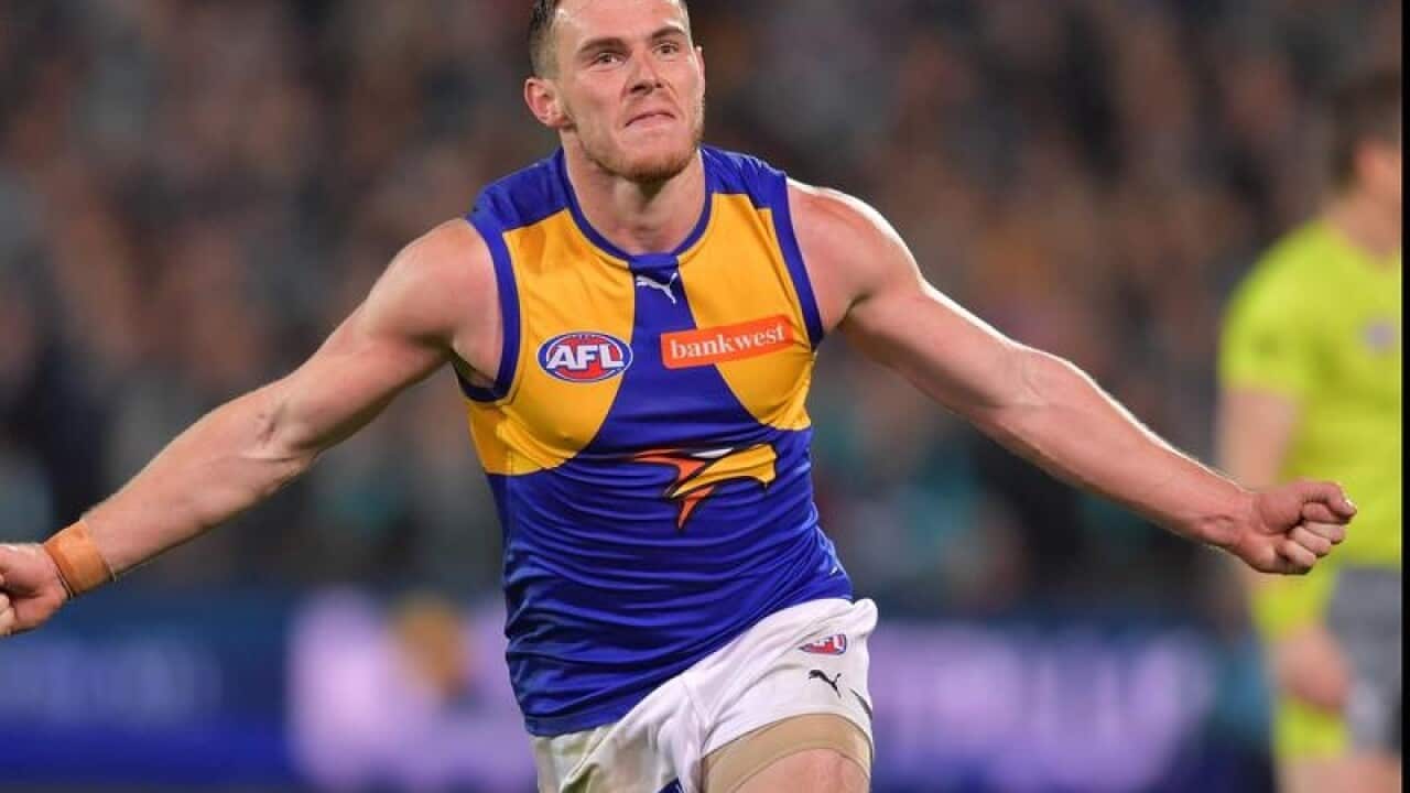 Luke Shuey celebrates his match-winning goal.