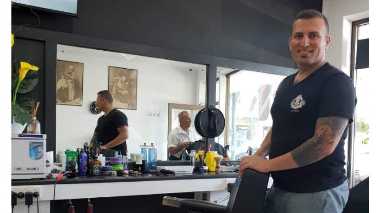 Ramal Hashim at his barber shop