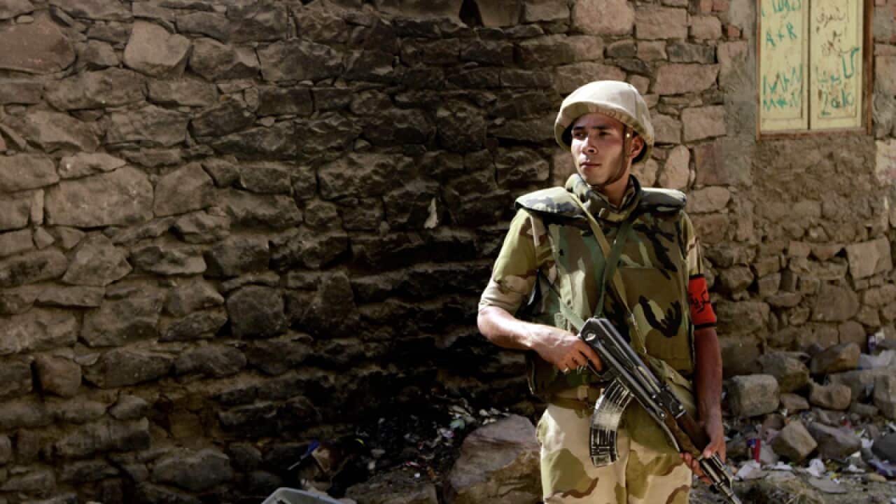 A military soldier stands guard
