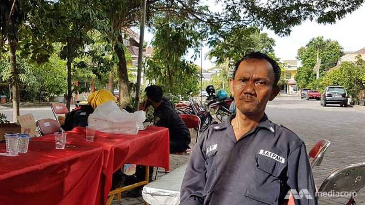 Housing complex security guard, 46-year-old Hery.