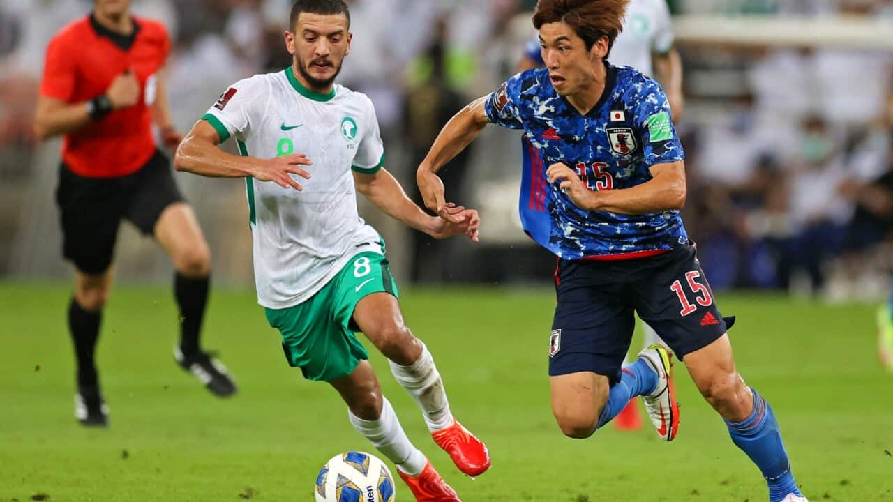 Saudi's midfielder Abdulellah al-Malki (L) vies for the ball with Japan's forward Yuya Osako during the 2022 Qatar World Cup Asian Qualifiers football match between Saudi Arabia and Japan, at the King Abdullah Sport City Stadium in Jeddah, on October 7, 2