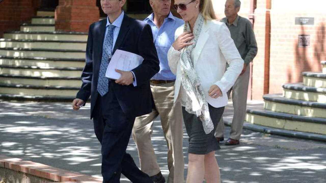 Jenny Geppert, the sister of Kim Hunt, leaves after giving her family impact statement at the coronial inquest into the deaths of Geoff Hunt, his wife Kim and their children Fletcher, Mia and Phoebe at Wagga Wagga Court.