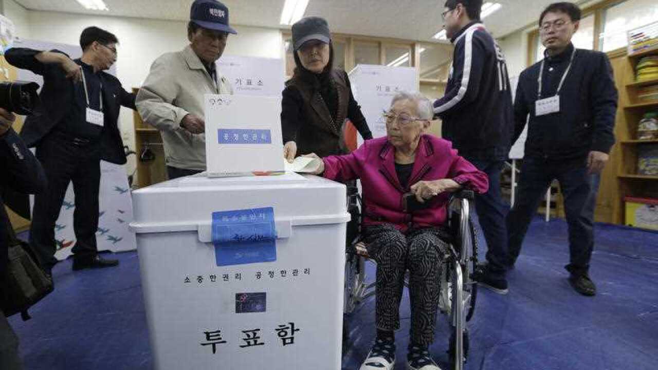 Residents cast their ballots for parliamentary elections at a polling station in Seoul, South Korea.