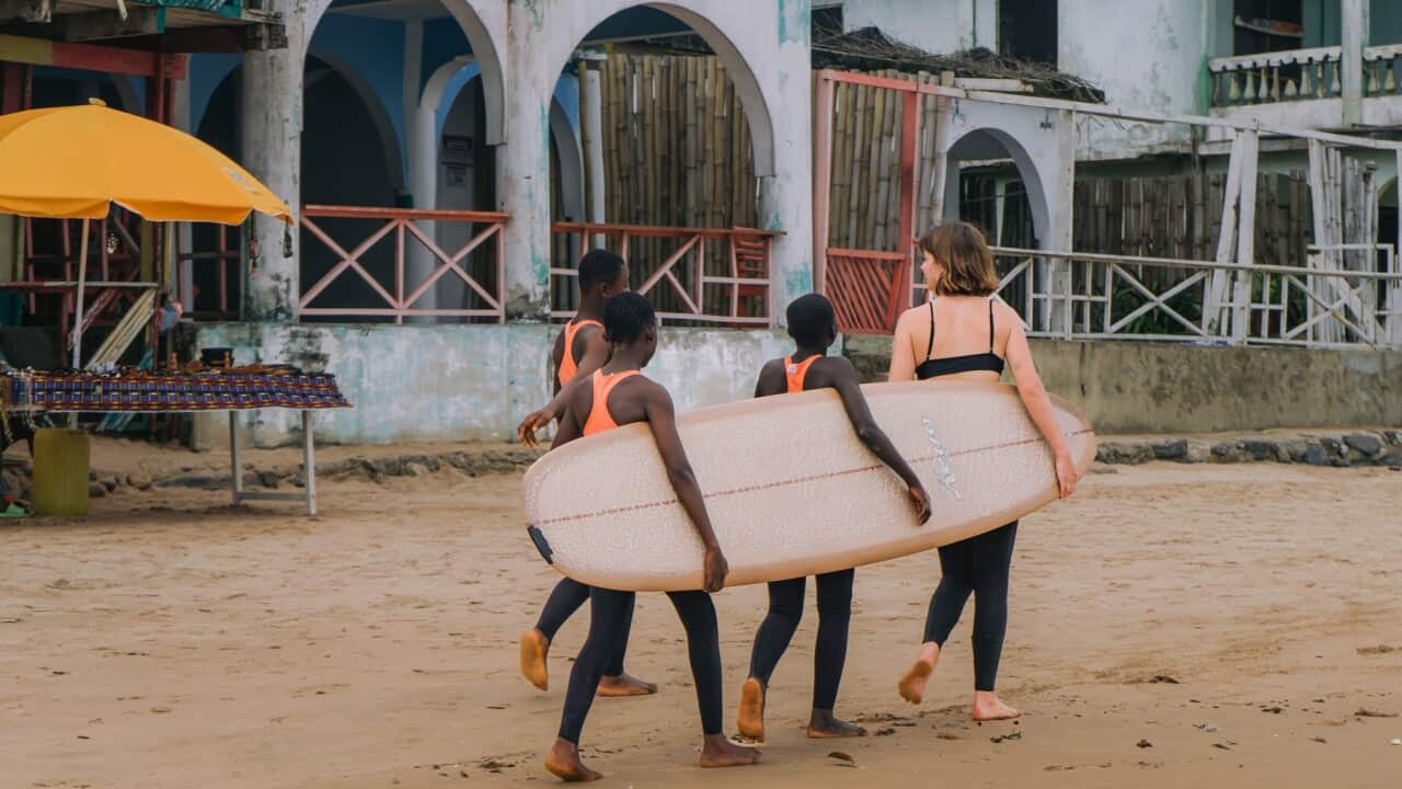 Surfer Lucy Small with Ghanaian surfer girls (Supplied-Maddie Mennings).jpg