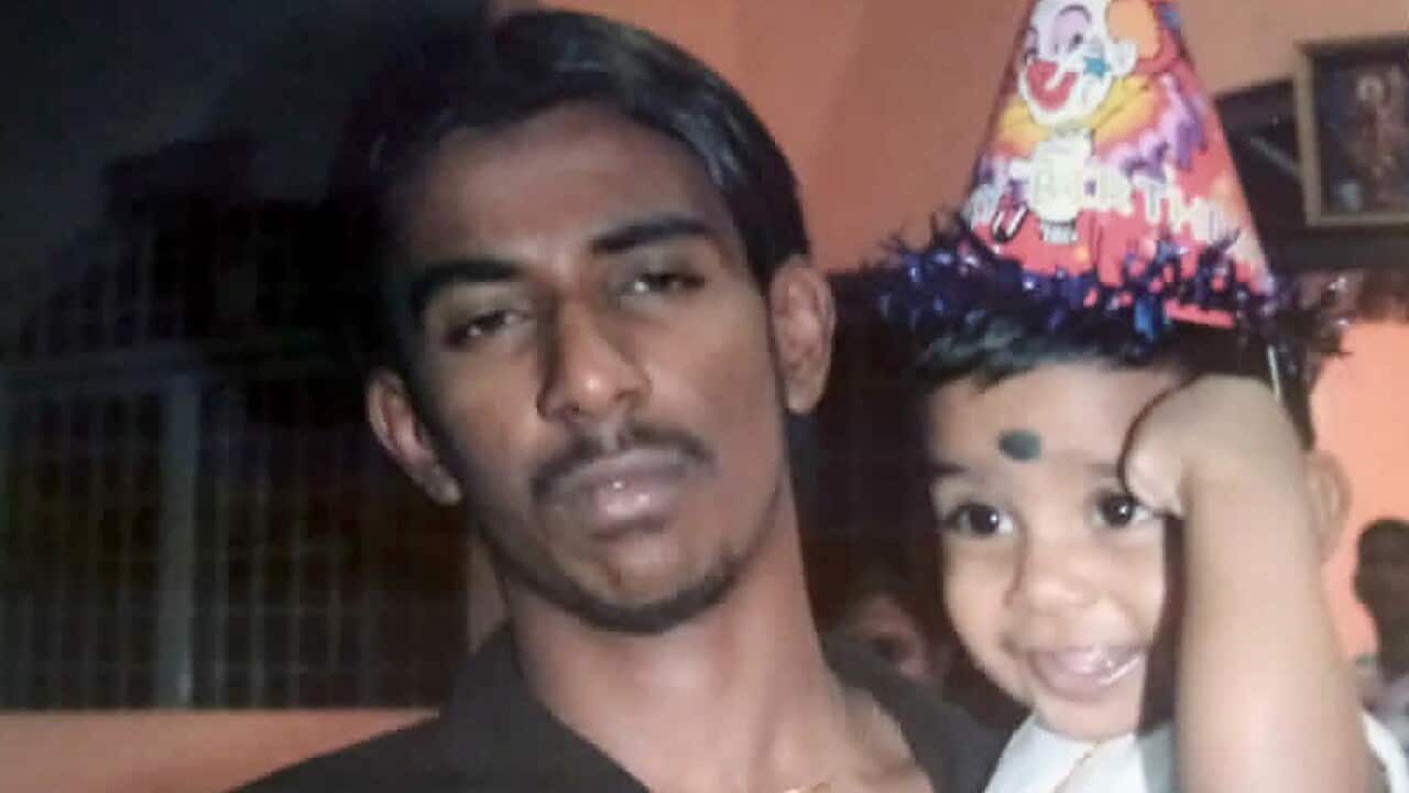 Nagaenthran K. Dharmalingam with a child.