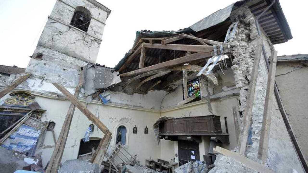 a damaged church in the village of Visso, Italy