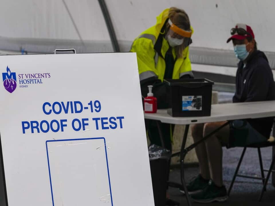A woman waits to receive a COVID-19 test in the eastern suburbs of Sydney Tuesday, Sept. 14, 2021.