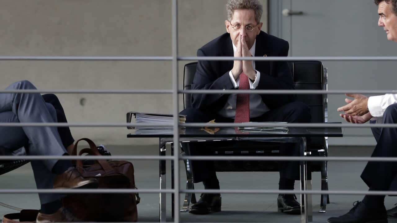 Germany's domestic intelligence chief, Hans-Georg Maassen, has been told to quit and move to a senior post at the interior ministry.