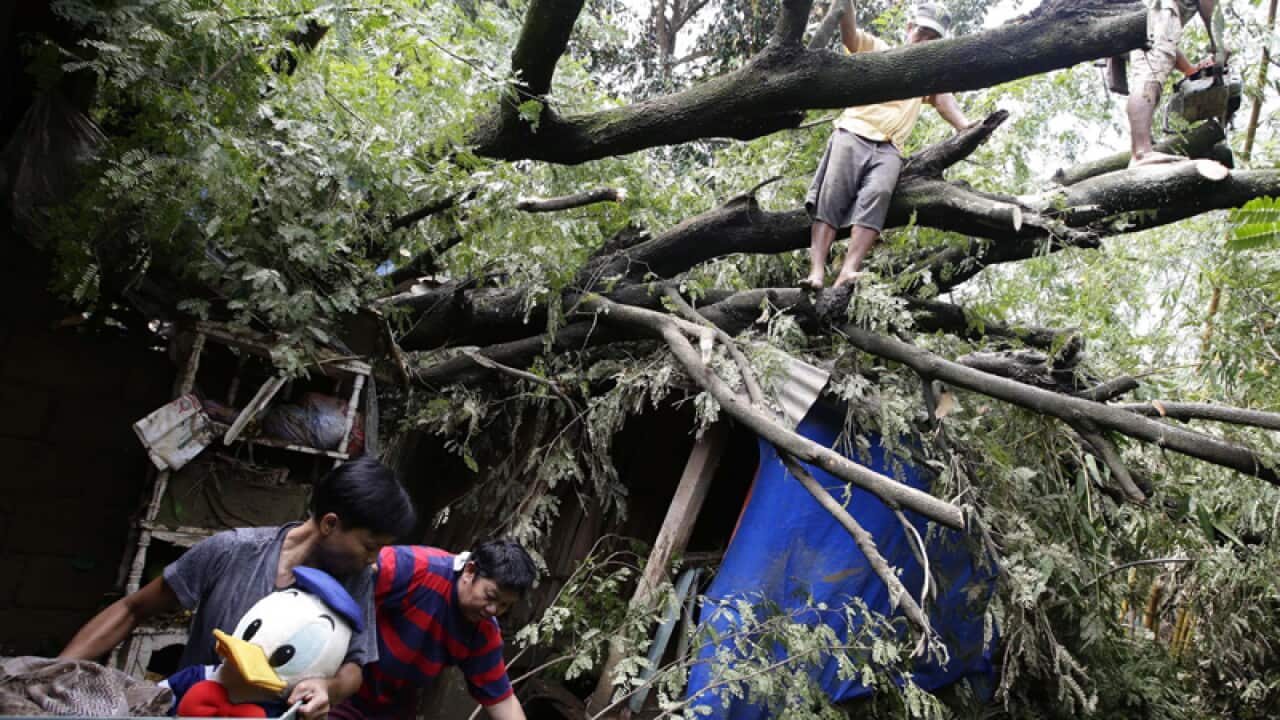 Filipinos recover belongings from their home, Philippines