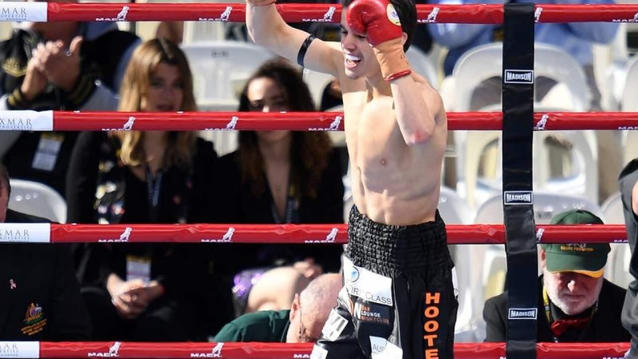 Australia's Brock Jarvis celebrates defeating Rasmanudin of Indonesia