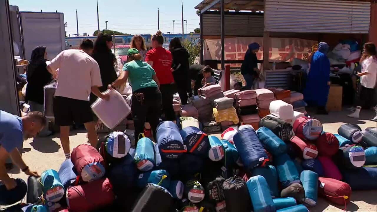 Volunteers sorting donated goods (SBS).jpg