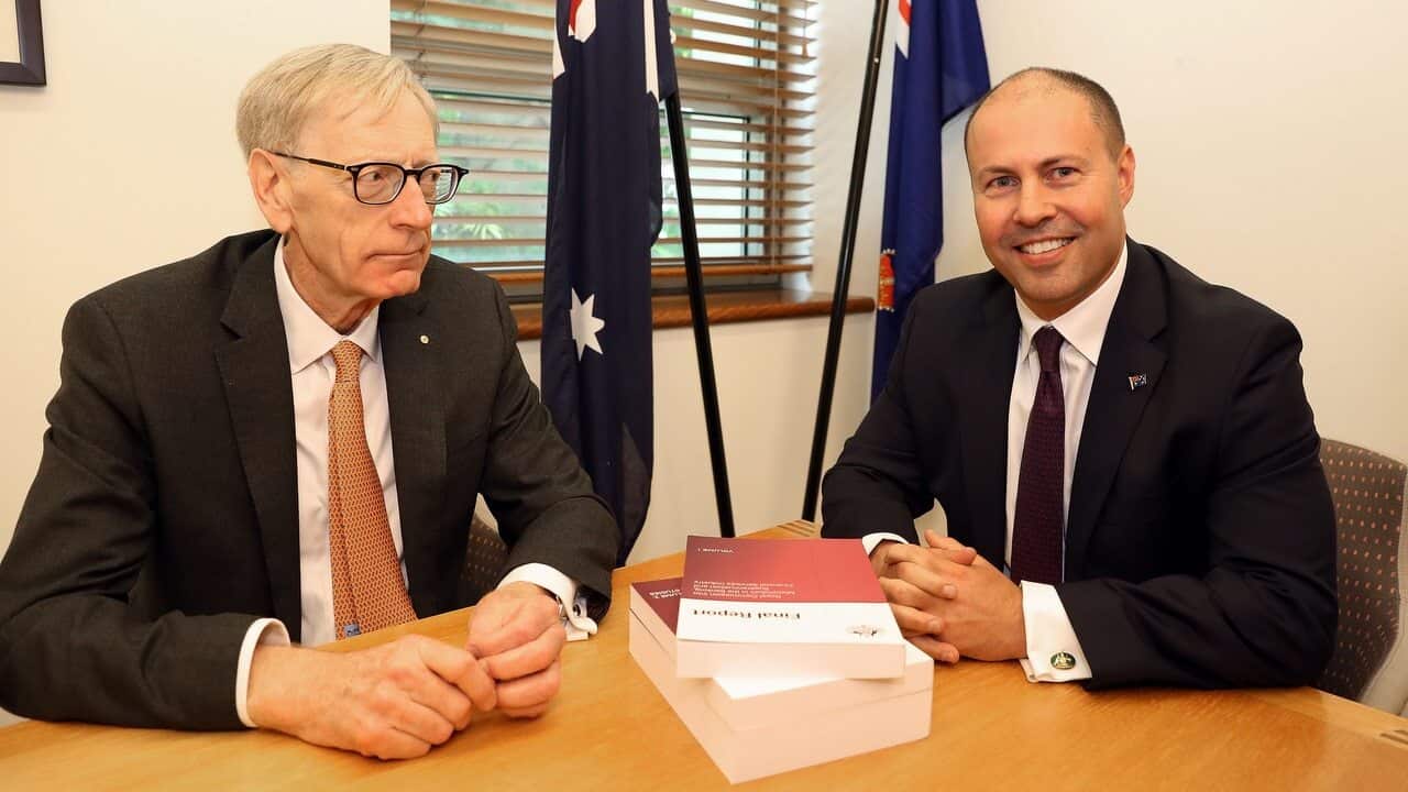 Commissioner Kenneth Hayne and Treasurer Josh Frydenberg with the final report from the Royal Commission into the Financial Services Industry.