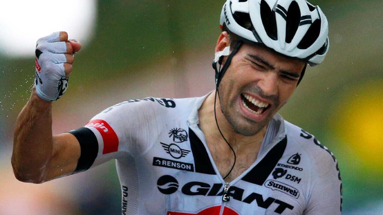 Tom Dumoulin crosses the finish line to win the 9th stage