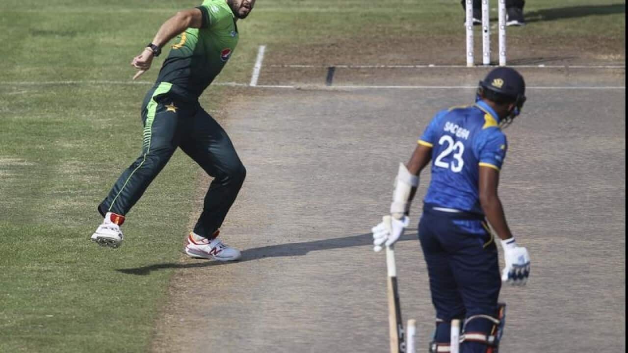 Usman Khan celebrates