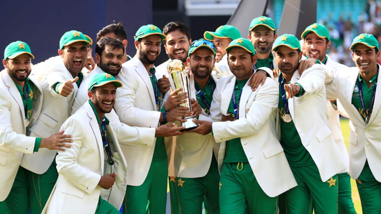 Members of the Pakistan team lift the ICC Champions Trophy