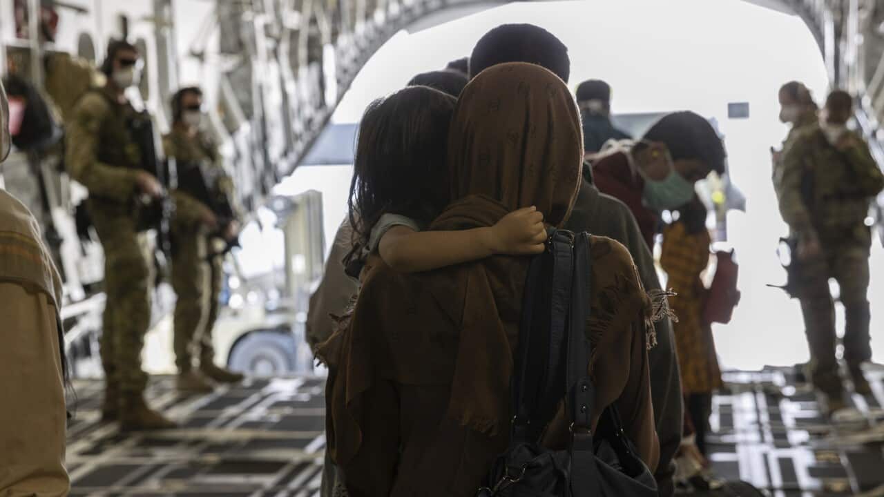 Afghanistan evacuees arrive at Australia's main operating base in the Middle East.