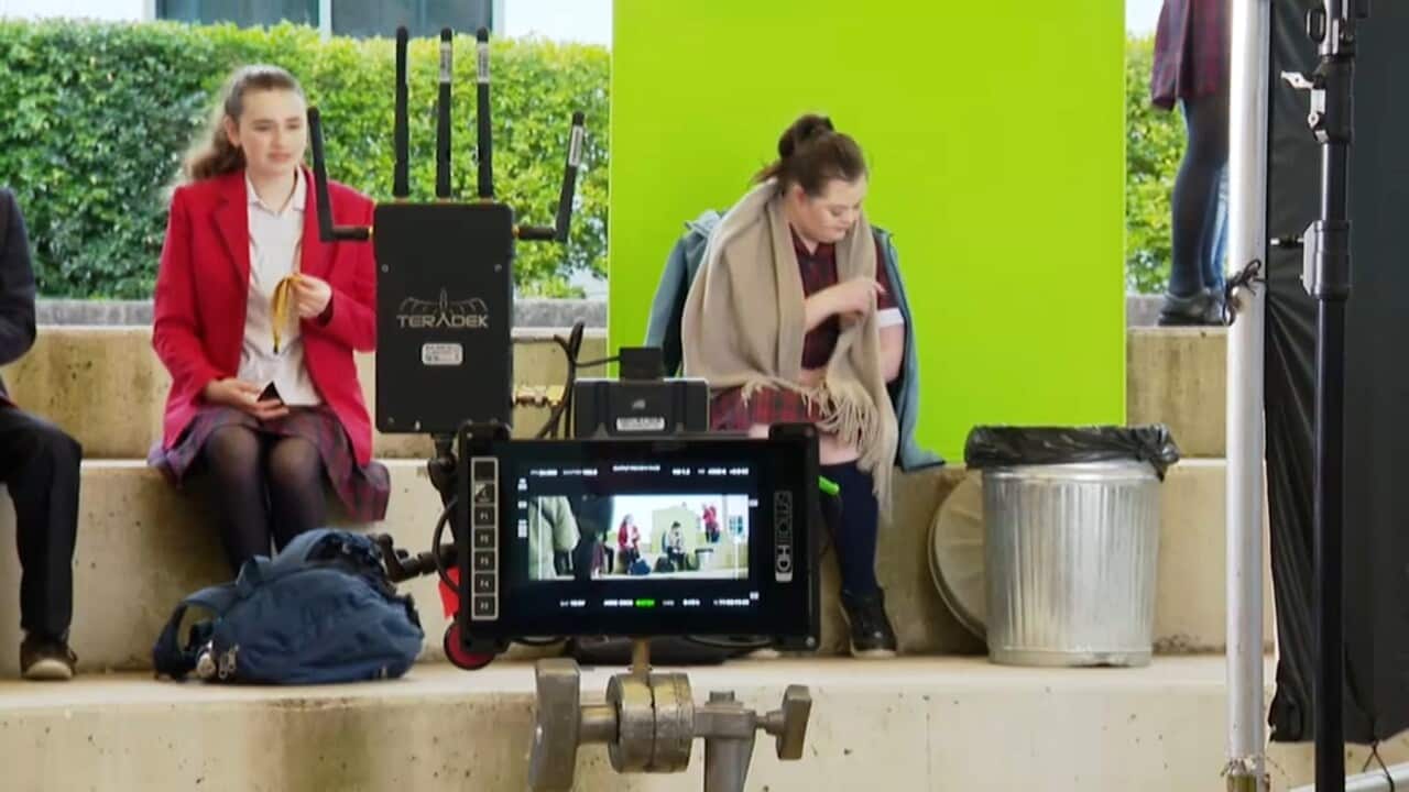 Audrey (right) on set