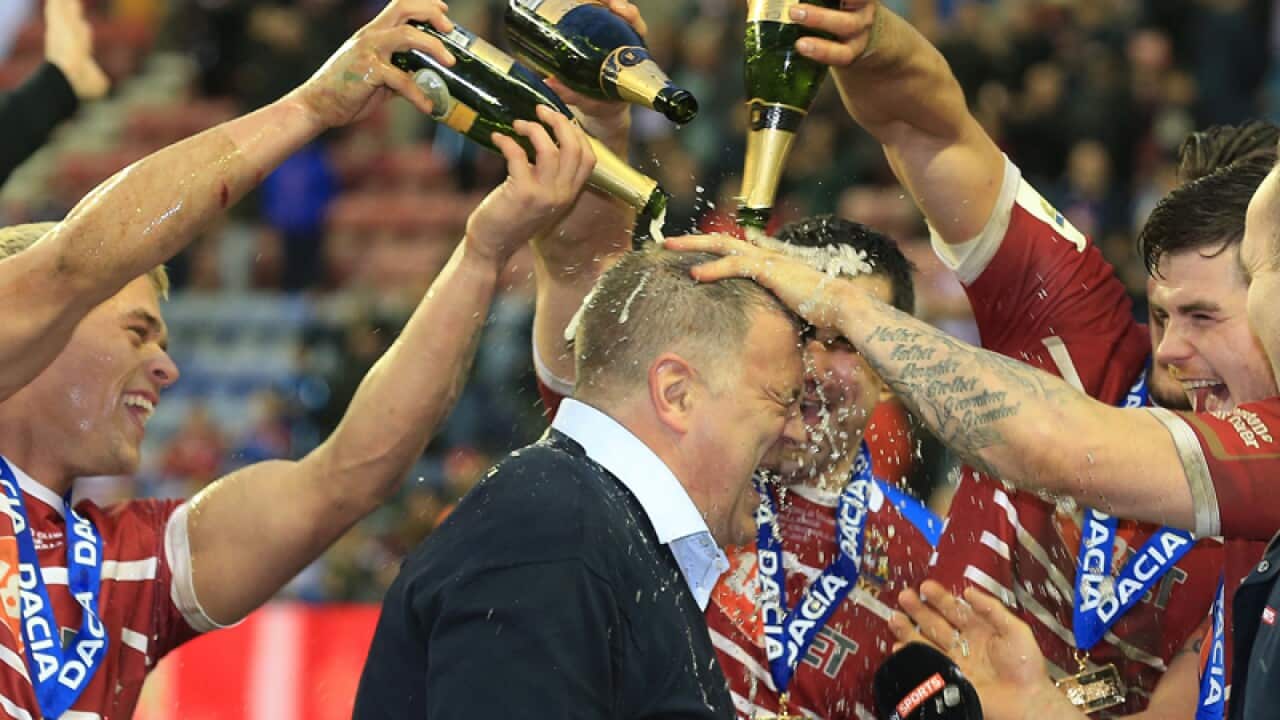 Wigan Warriors head coach Shaun Wane is showered by champagne