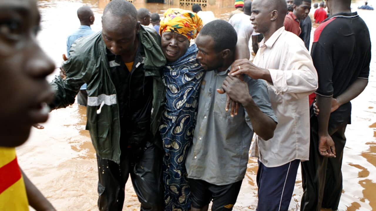 Rescuers evacuate a victim from a flooded area of Bamako