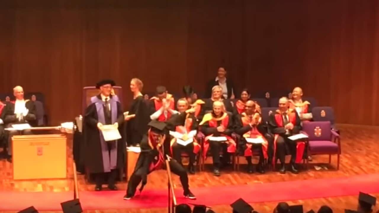 Wang about to receive his degree.