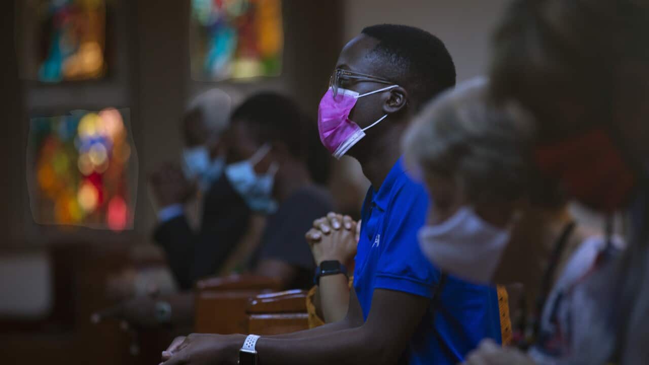 Congregants wear face masks to protect against coronavirus as they attend an Easter Sunday Mass at the Roman Catholic Church in Rosebank, Johannesburg, Sunday March 4, 2021. (AP Photo/Denis Farrell)