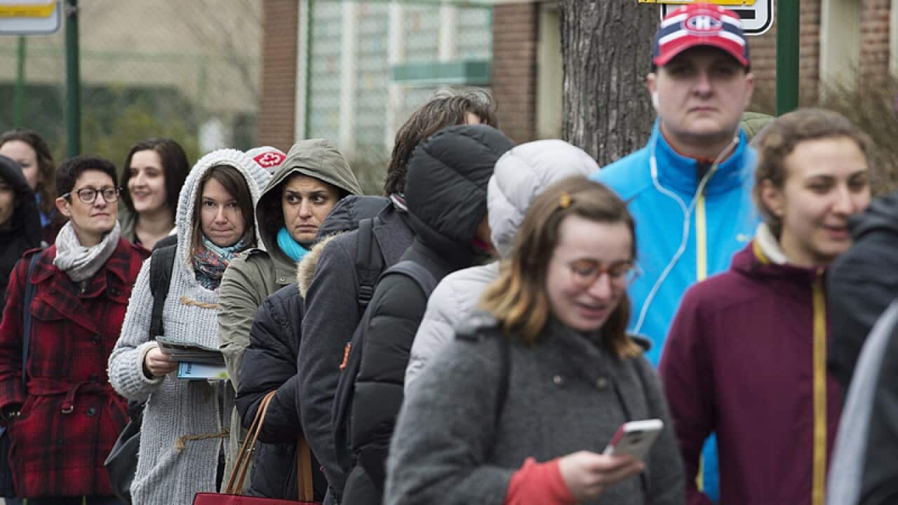 French expats wait in line to vote