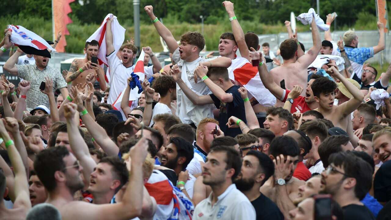 English supporters celebrate at 4TheFans Fan Park, in Manchester, England.