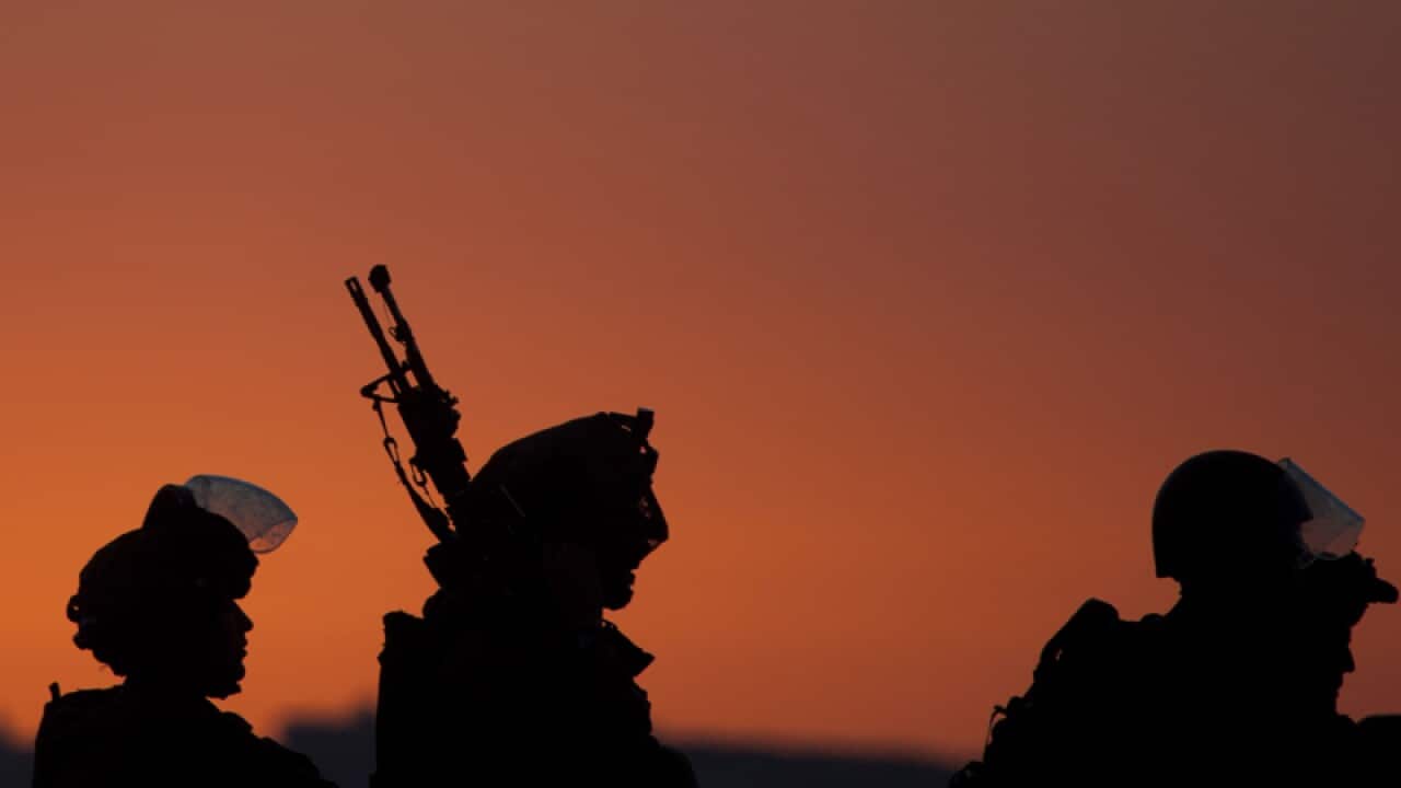 Israeli soldiers patrol during clashes with Palestinians