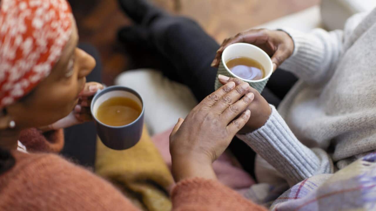two women drinking tea