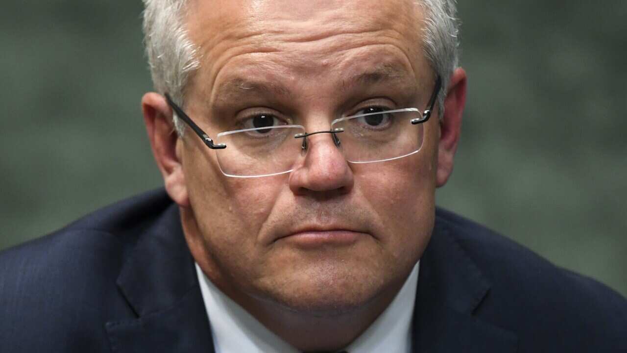 Prime Minister Scott Morrison reacts during House of Representatives Question Time at Parliament House in Canberra.