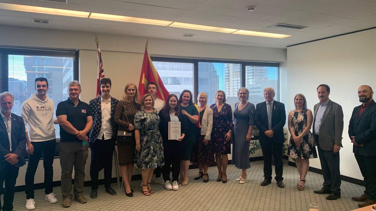 Graduates studying Macedonian at the graduation ceremony in the Macedonian Consulate