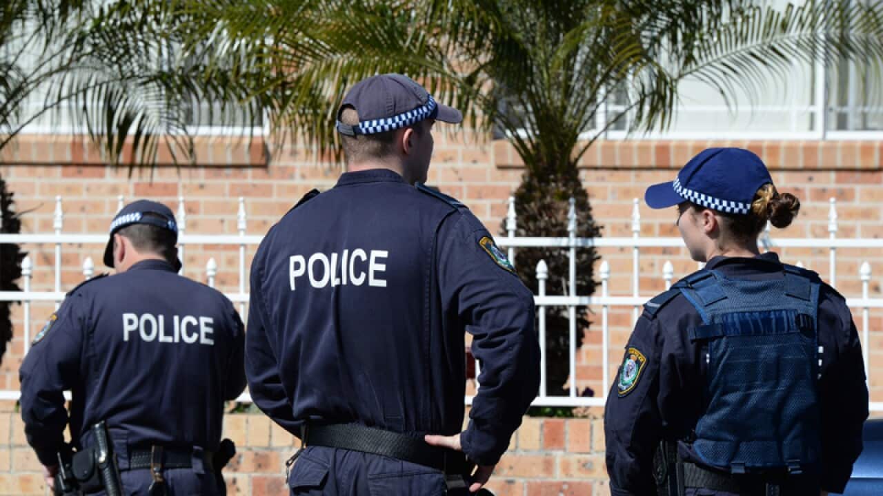 Police officers during raids in Sydney's west