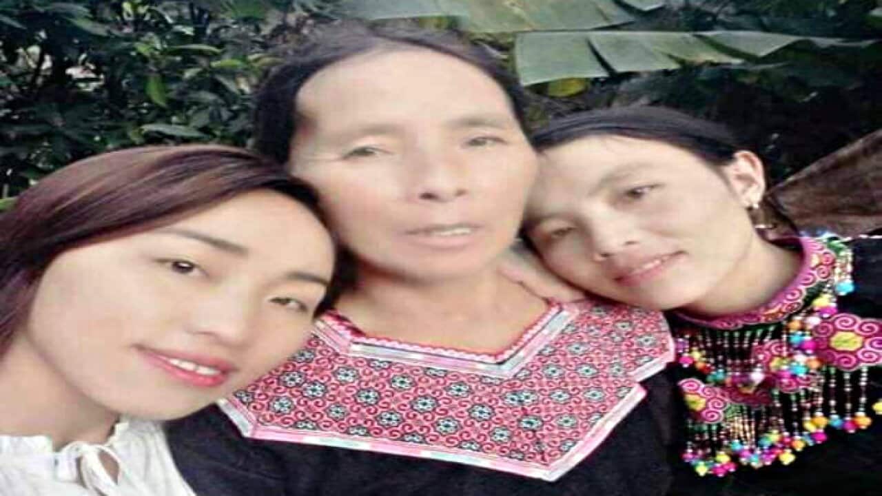 Mee Fang and her two daughters
