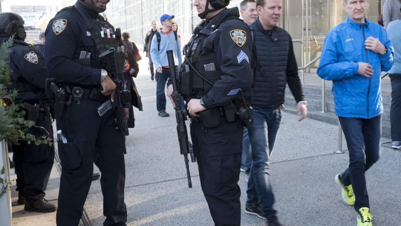 Police stand guard outside the Jacob Javits Convention Center