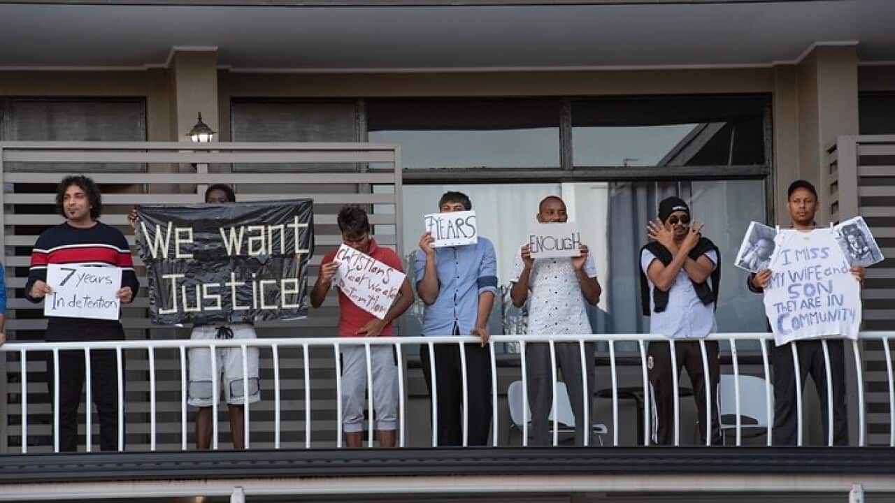 Asylum seekers and human rights demonstrators rally to protest against detention of refugees amid the coronavirus.