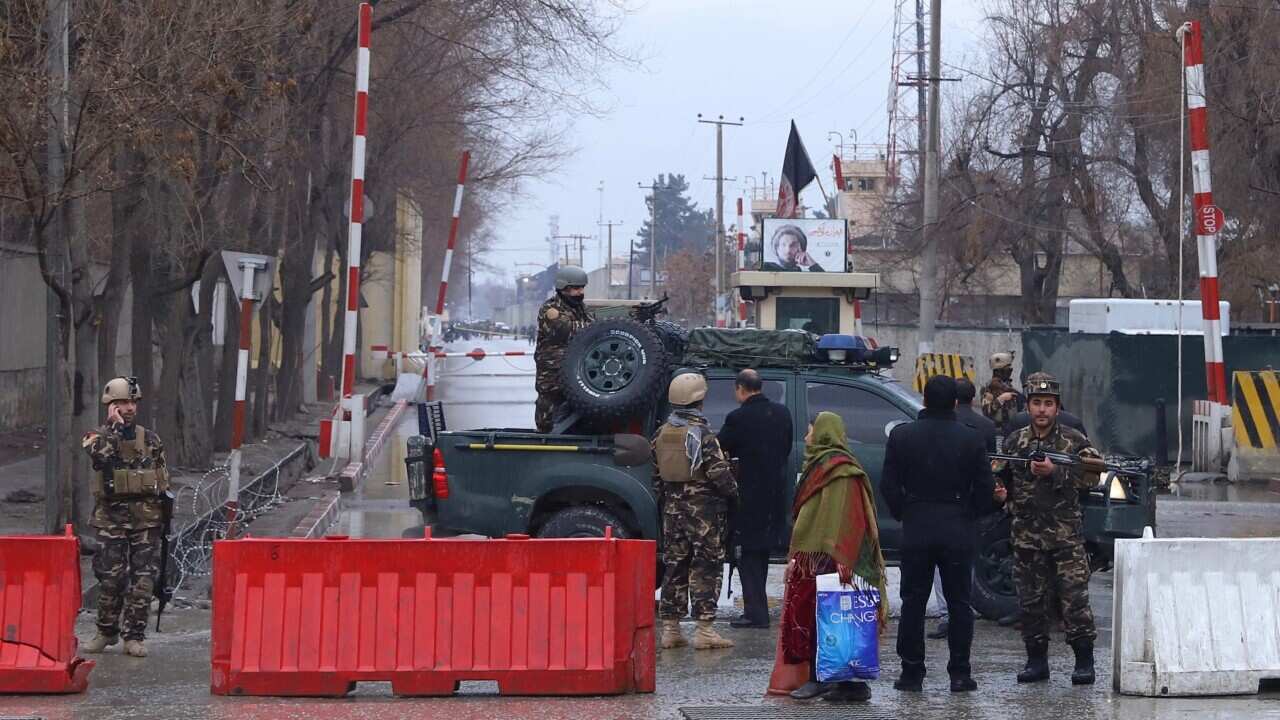 Afghan security officers secure the area of an explosion at a diplomatic area in downtown Kabul.