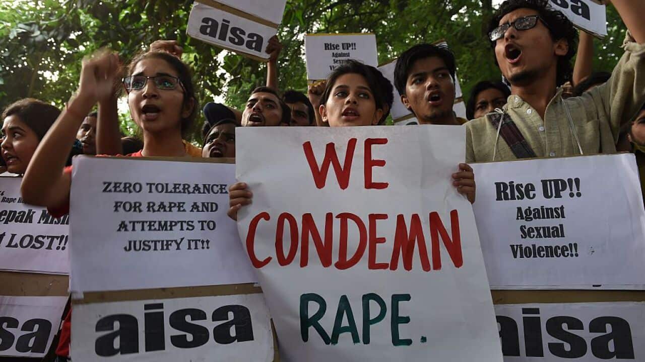 Indian students shout slogans during a protest against the rapes of two minor girls outside the police headquarters in New Delhi on October 18, 2015.