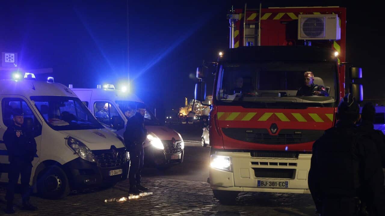 A rescue workers truck leaves the port of Calais following the tragedy at sea