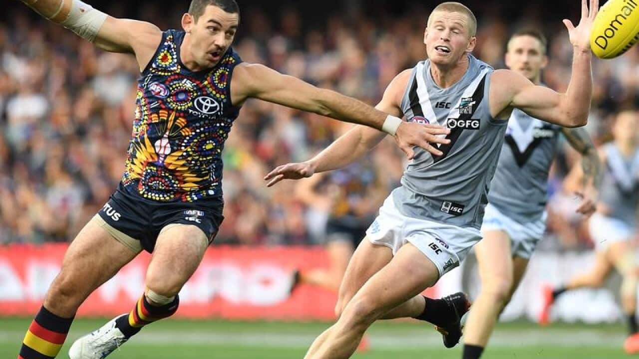 Adelaide captain Taylor Walker (L)