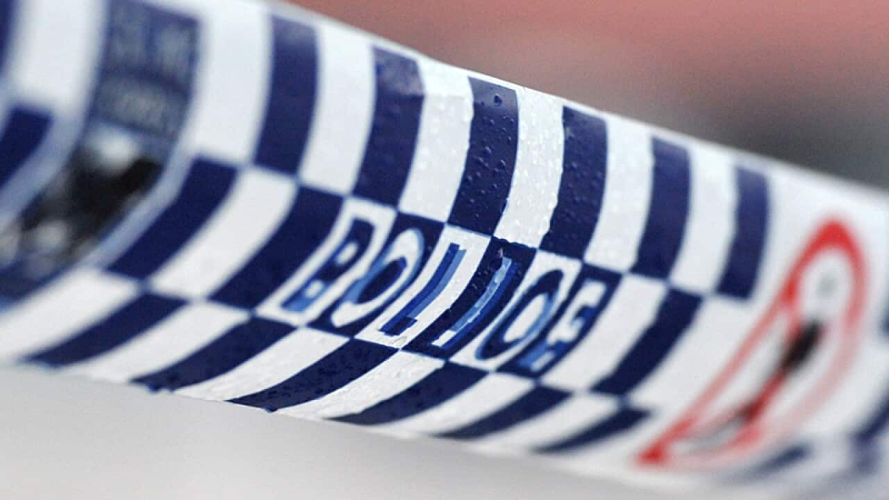 Police tape restricts access to a crime scene