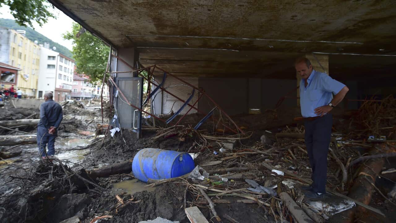 People in the aftermath of the floods in Bozkurt town of Kastamonu province, Turkey, Friday, Aug. 13, 2021.