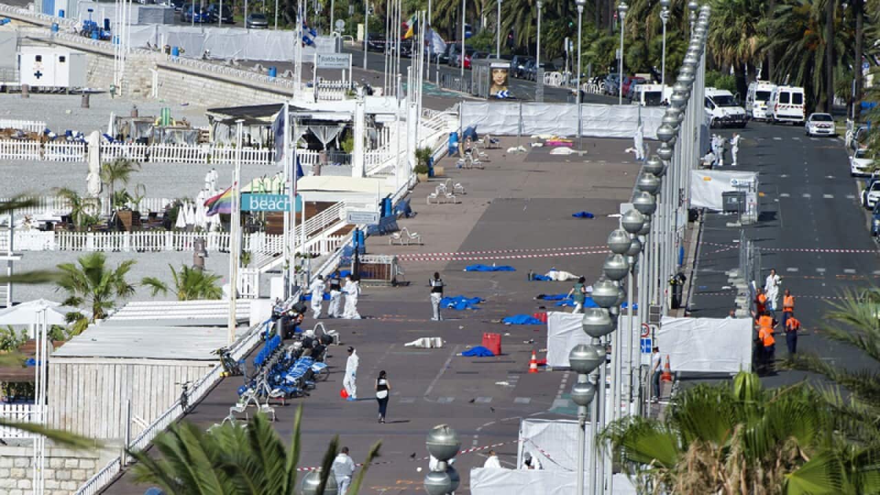 Crime scene investigators work on the 'Promenade des Anglais'