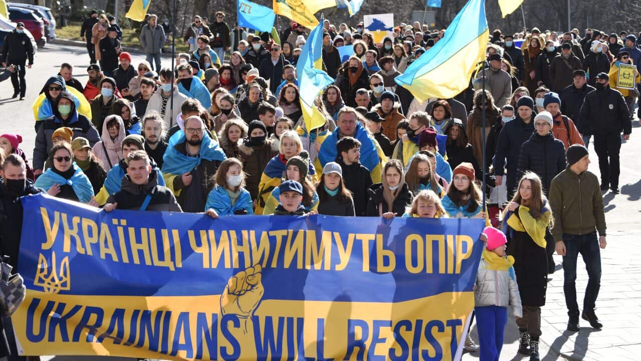 People march behind a banner reading "Ukrainians will resist" during a rally on February 19, 2022, in the centre of the western Ukraine city of Lviv.