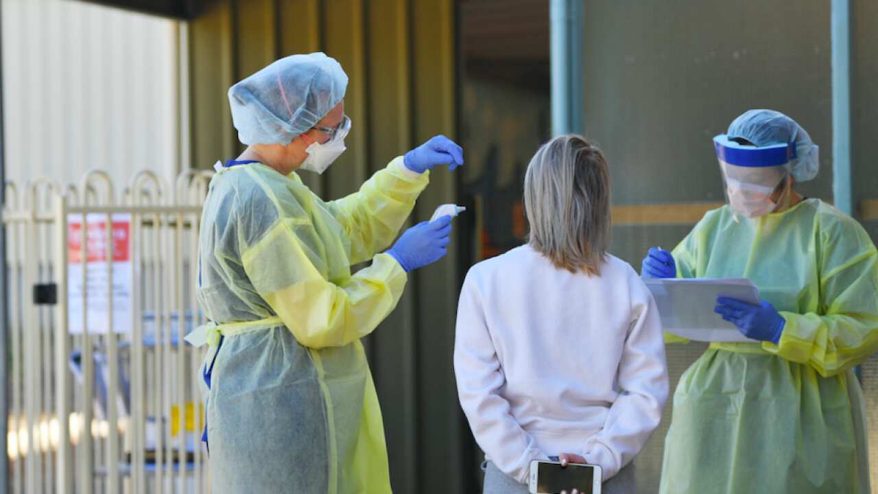Hospital staff test people in Adelaide.