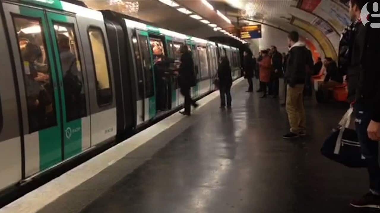 A video grab taken from footage obtained from Guardian News & Media Ltd in the United Kingdom on February 18, 2015 shows Chelsea football fans packed onto a Paris Metro train pushing a passenger to prevent him from boarding the carriage 