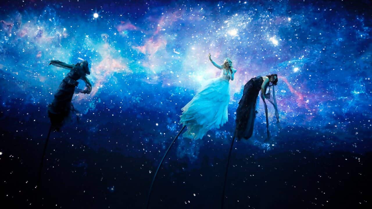 Kate Miller-Heidke of Australia, center, performs the song "Zero Gravity" during the 2019 Eurovision Song Contest grand final in Tel Aviv, Israel, Saturday, May 18, 2019. (AP Photo/Sebastian Scheiner)